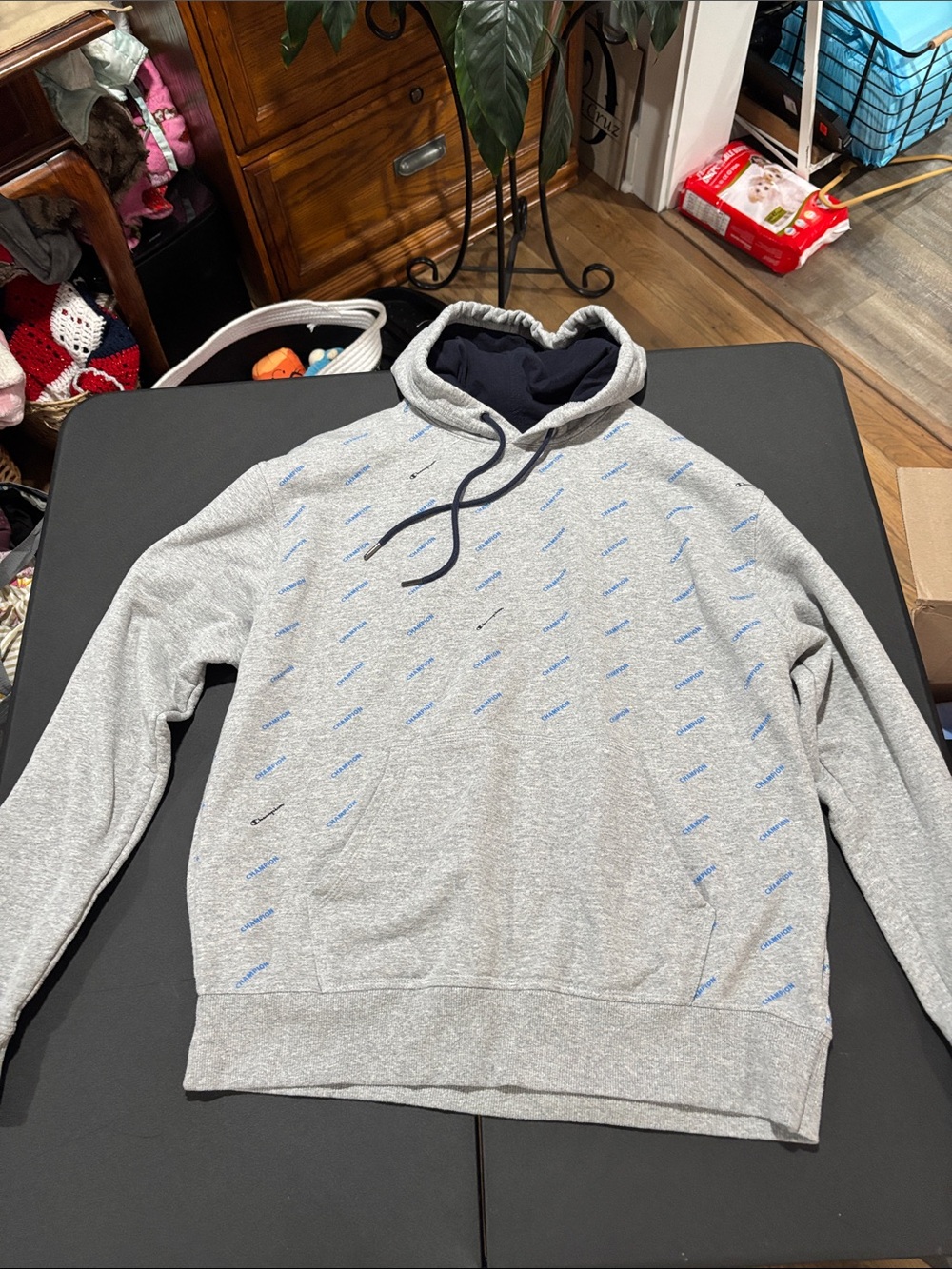 Champion Men's Gray Hooded Sweatshirt with Subtle Blue Logo Pattern